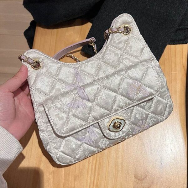 chinoiserie-gold-brocade-underarm-bag-table-top-view chinoiserie-gold-brocade-underarm-bag-table-top-view