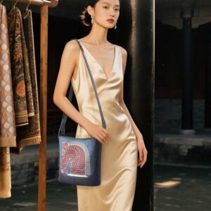 hinoiserie-horse-embroidered-leather-crossbody-bag-model-wearing-front-view