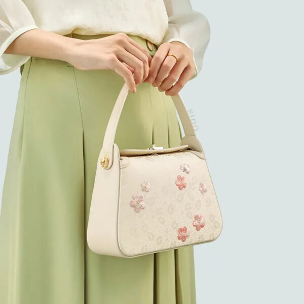 model-holding-plum-blossom-bag-both-hands-front model-holding-plum-blossom-bag-both-hands-front